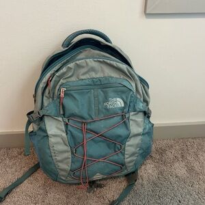 The North Face Blue Backpack with Pink Accents
